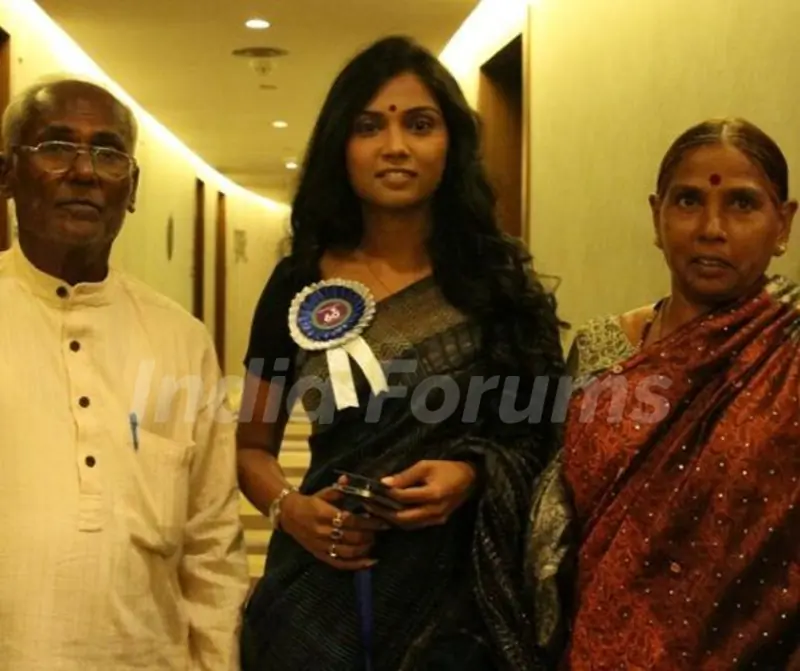 Usha Jadhav with her parents