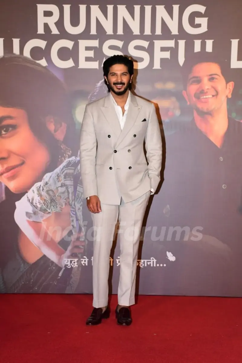 Dulquer Salmaan snapped at Sita Ramam's success press conference in a double breasted, beige suit and trousers