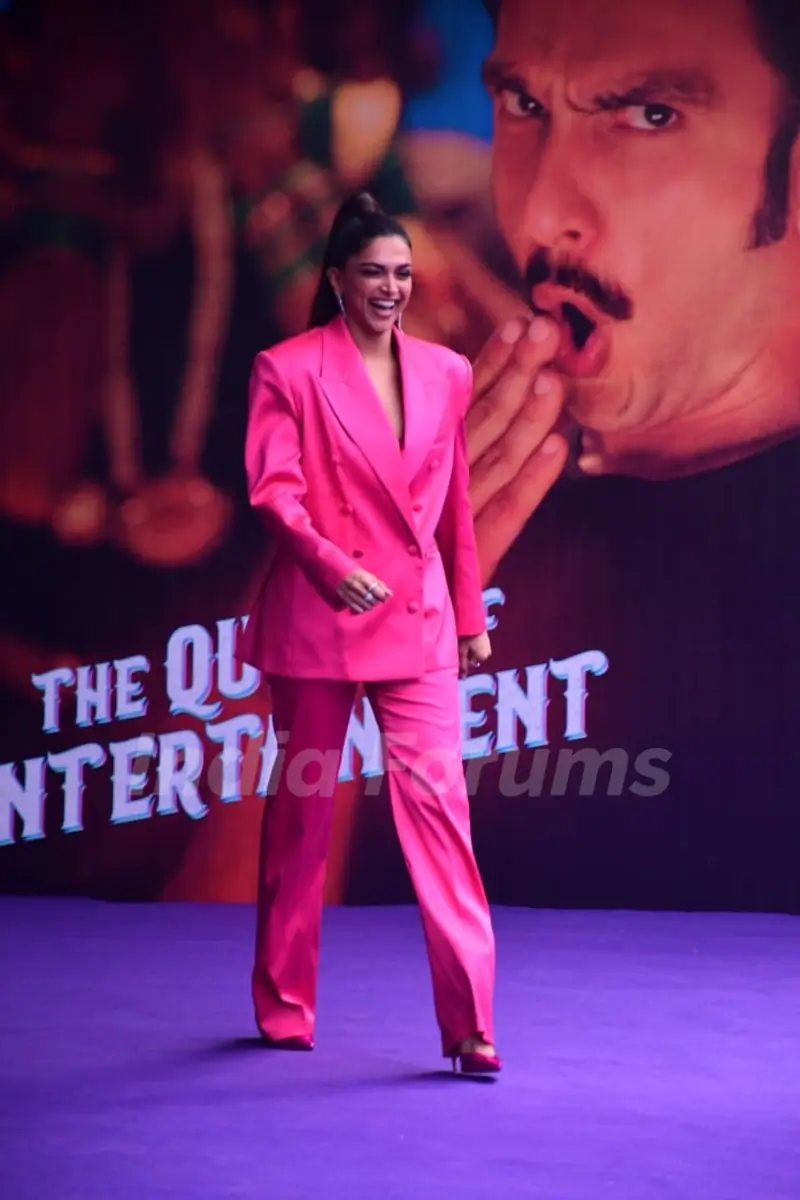 Deepika Padukone looks electrifying in a hot pink, oversized blazer, matching trousers and pumps at the launch of the song #CurrentLaga
