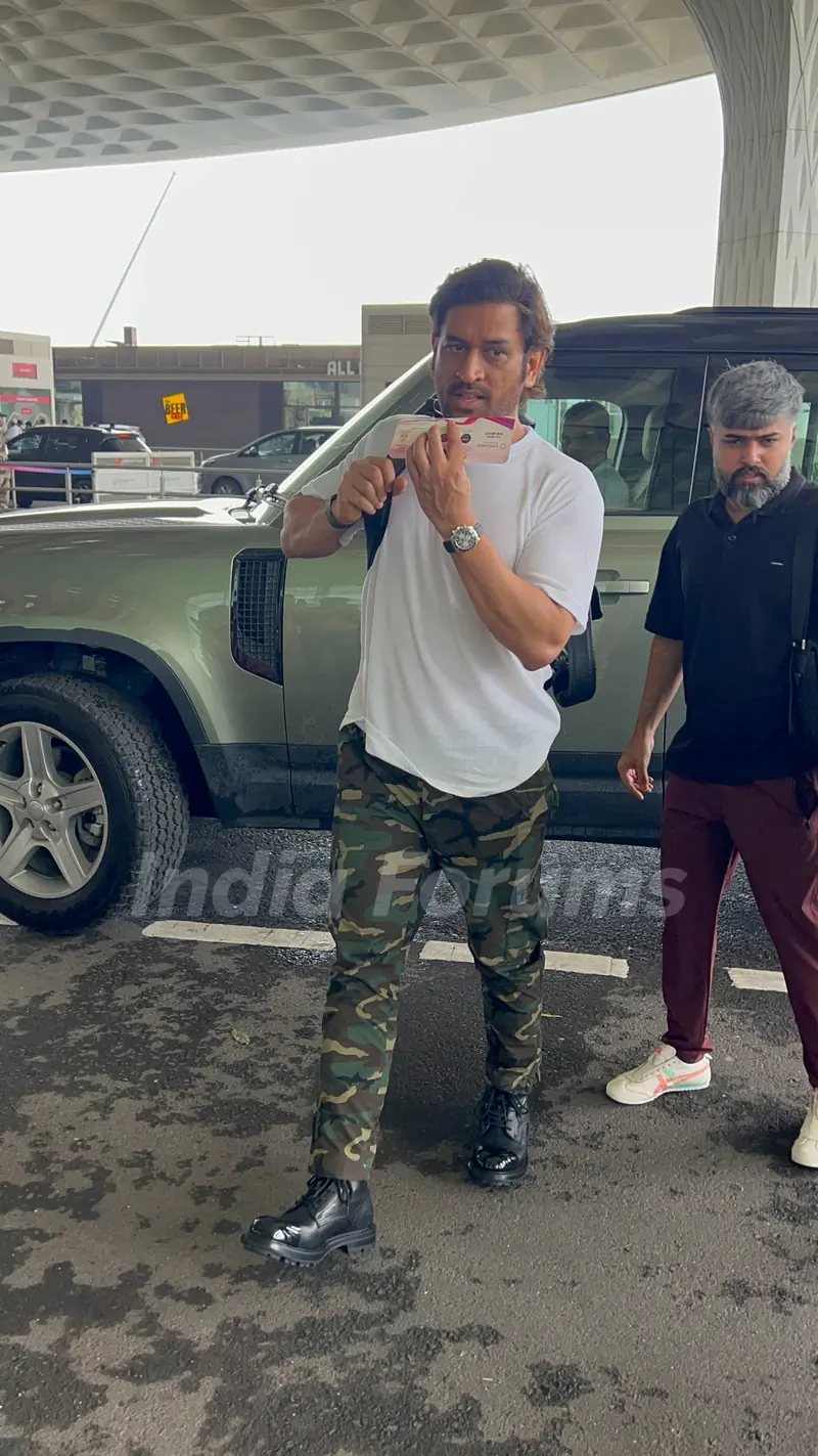 Mahendra Singh Dhoni snapped at airport