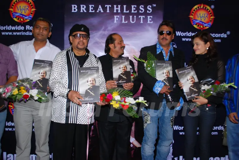 Jazz Musician Louis Banks, Pandit Ronu Majumdar, Jackie Shroff and Yuvika Chaudhary pose for the photographers during their album launch of "Breathless Flute" in Mumbai