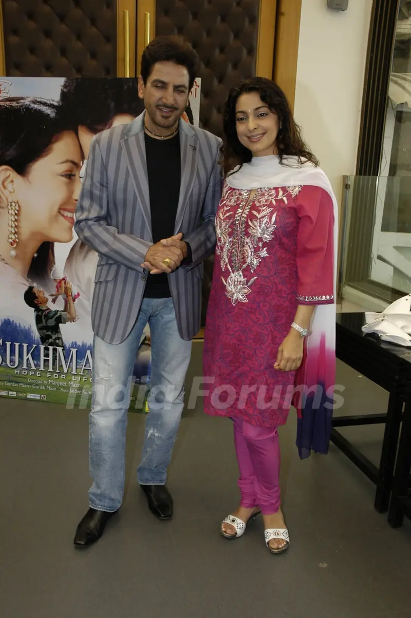 Bollywood actor Gurdas Maan and Juhi Chawla, pose for the photographers during the press conference of film "Sukhmani- Hope for Life" in Mumbai on Thursday, 28 January 2010