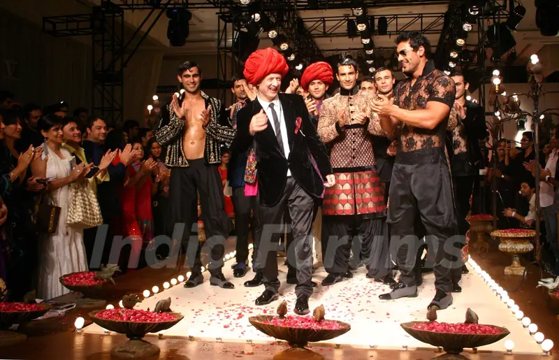Designer Rohit Bal with Bollywood actor John Abraham  during his show  at the Ven Heusen India Mens Week, in New Delhi