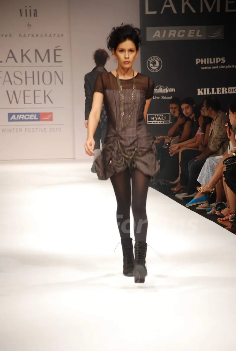 A model walks the runway in an Viia design at the Lakme Fashion Week