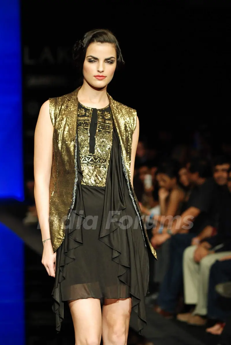 A model walks the runway in an Ritu Kumar design at the Lakme Fashion Week
